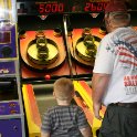 Jacob plays Skee Ball with Daddy